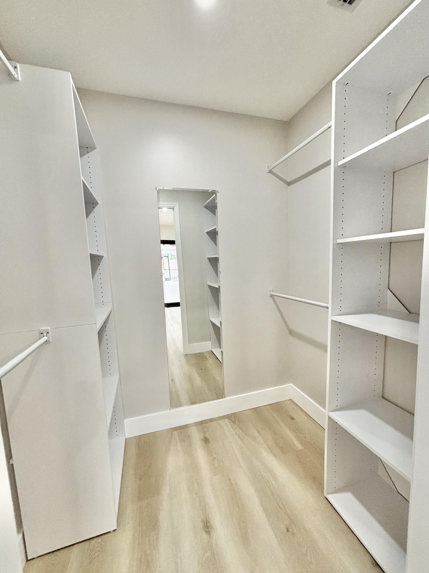 14 Southeast Paddock Circle Jupiter, FL 33469 - Photo 14 of 45 a view of an empty walk in closet