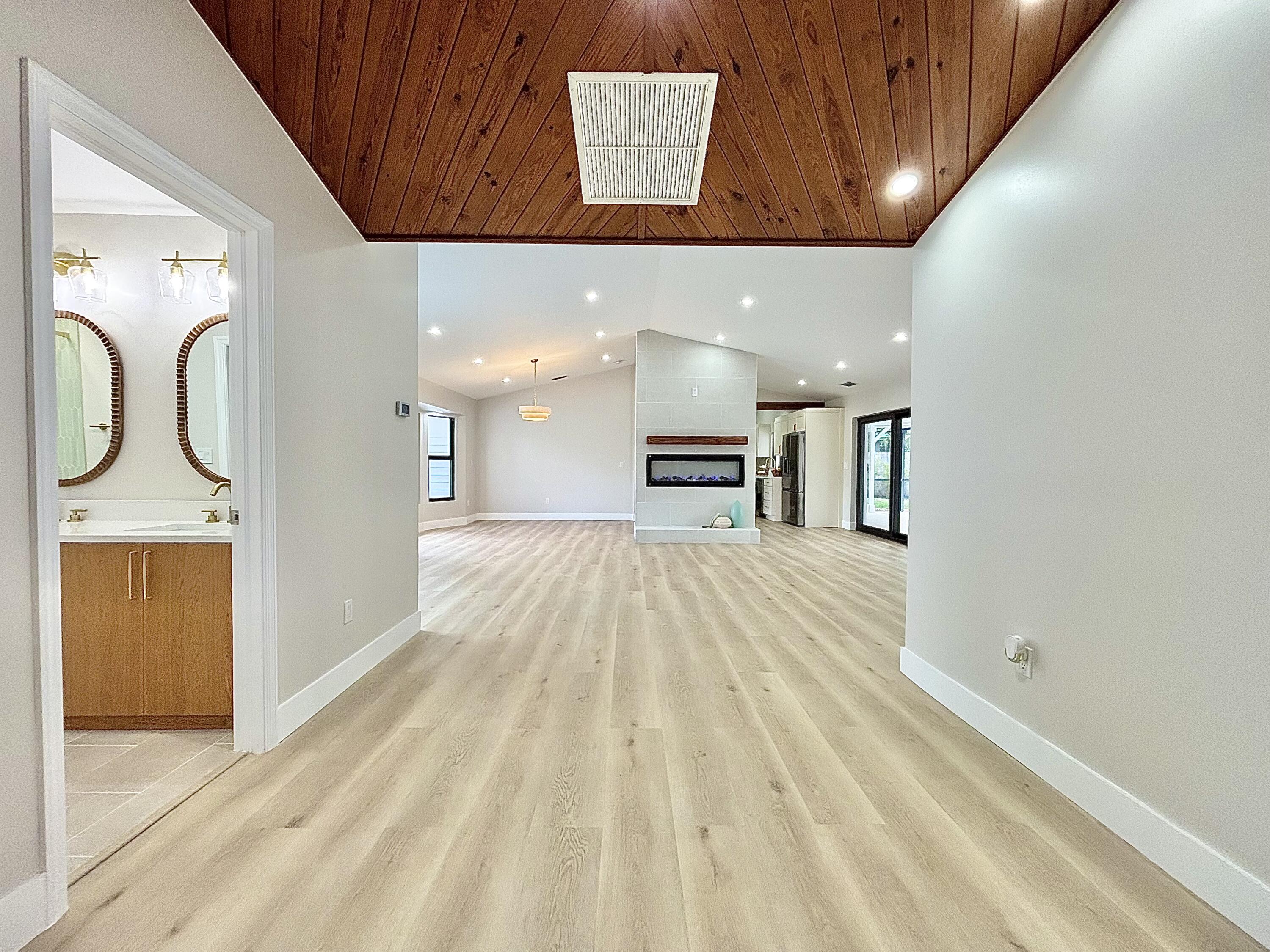 14 Southeast Paddock Circle Jupiter, FL 33469 - Photo 15 of 45 a view of kitchen with a sink and a fireplace