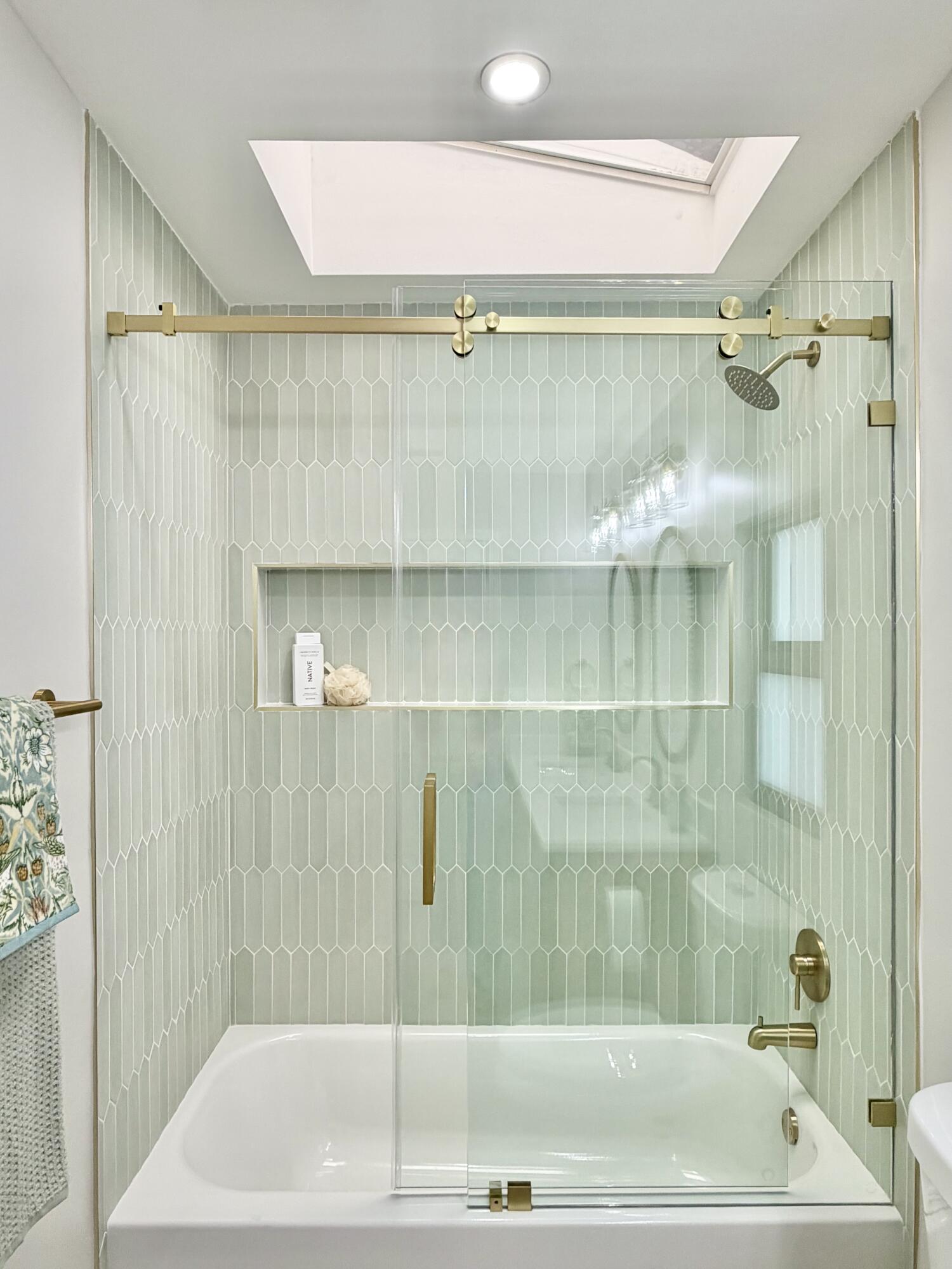 14 Southeast Paddock Circle Jupiter, FL 33469 - Photo 19 of 45 a bathroom with a shower and a bathtub