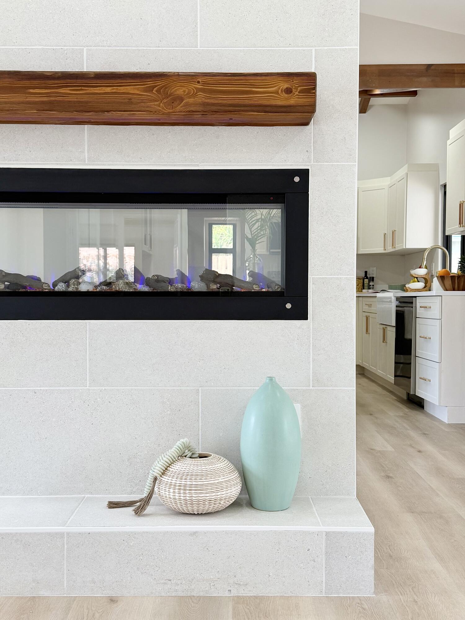 14 Southeast Paddock Circle Jupiter, FL 33469 - Photo 24 of 45 a living room with furniture and a fireplace