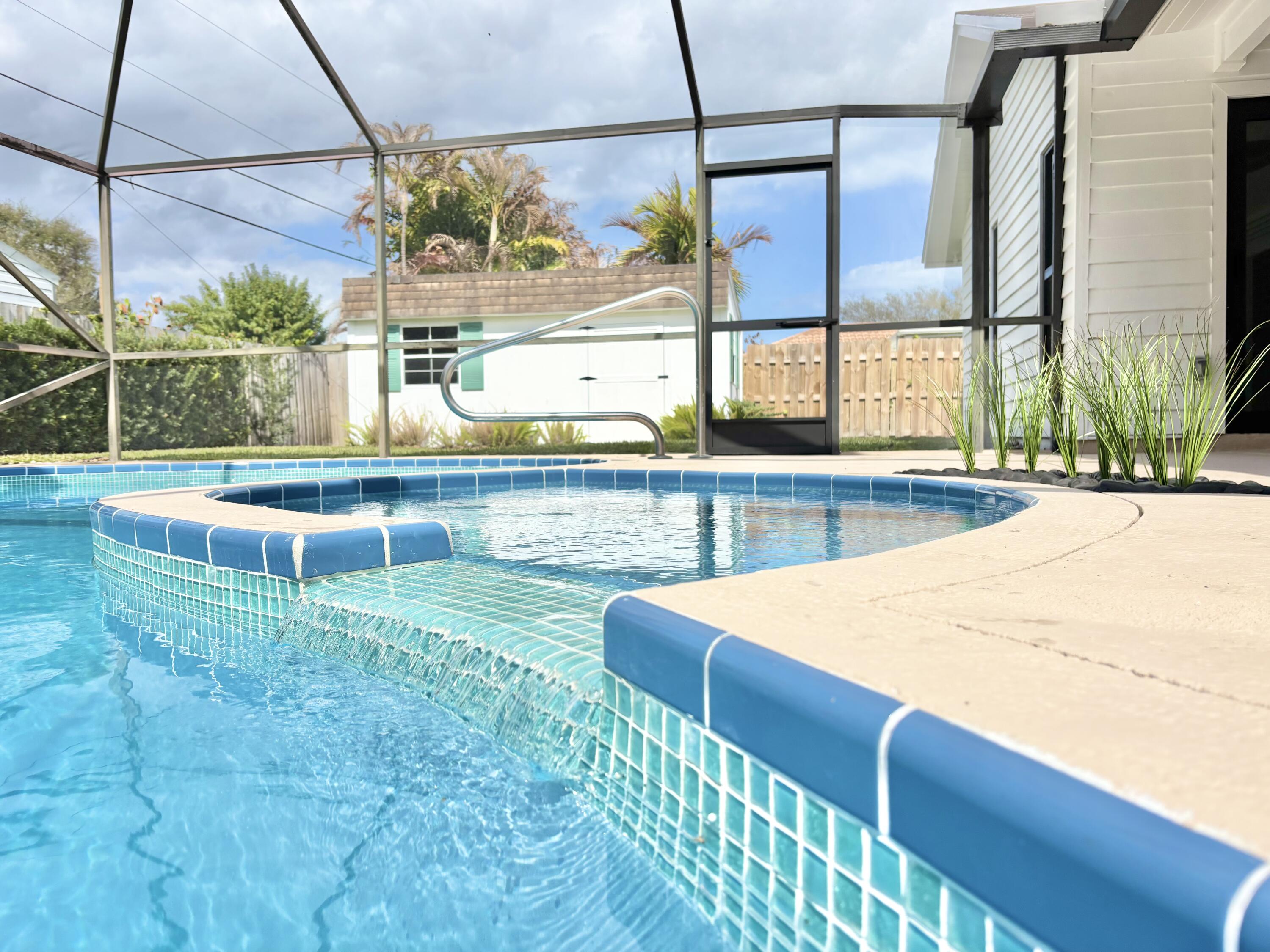 14 Southeast Paddock Circle Jupiter, FL 33469 - Photo 29 of 45 a view of a backyard with sitting area