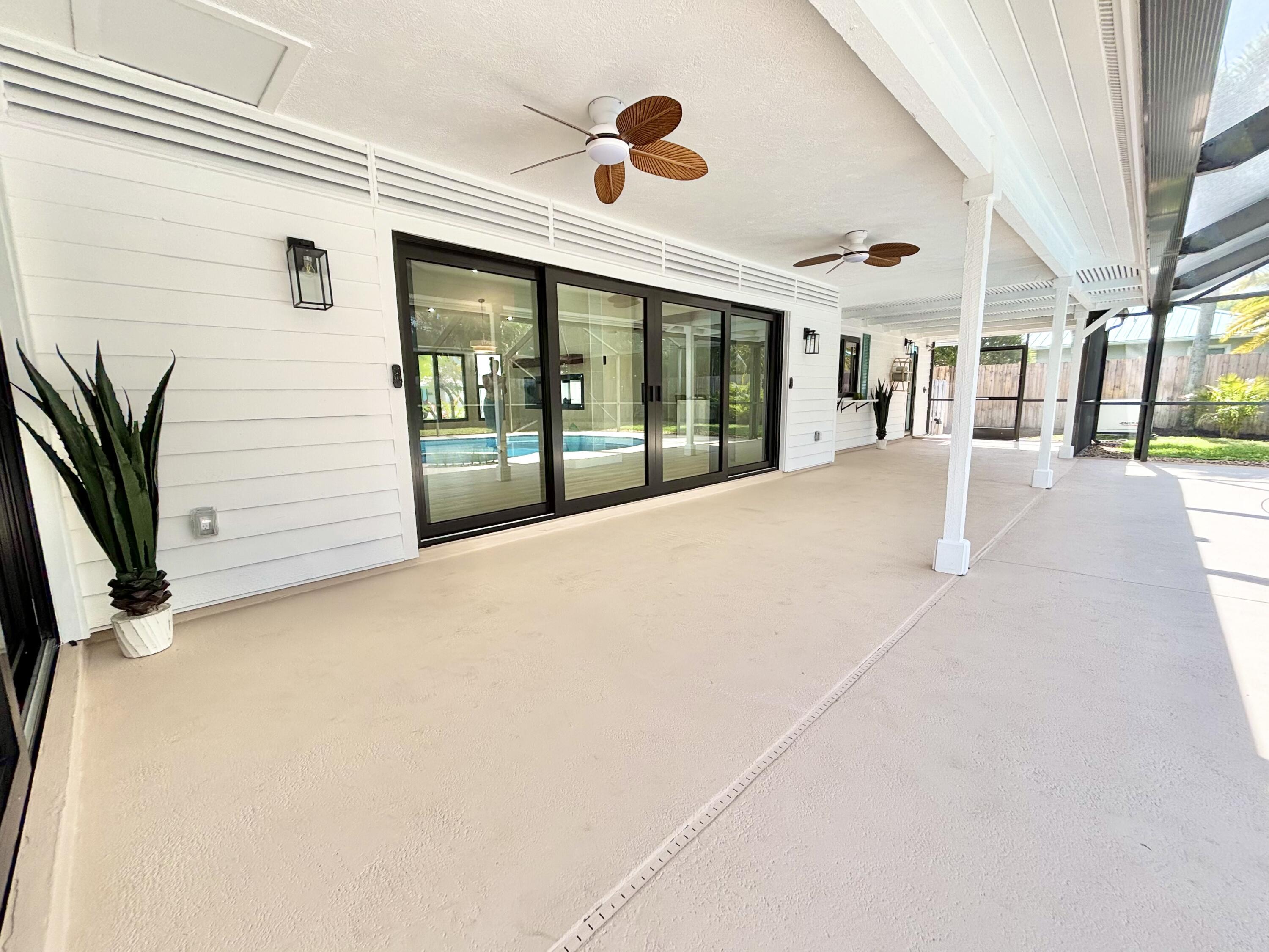 14 Southeast Paddock Circle Jupiter, FL 33469 - Photo 30 of 45 a view of porch with seating space