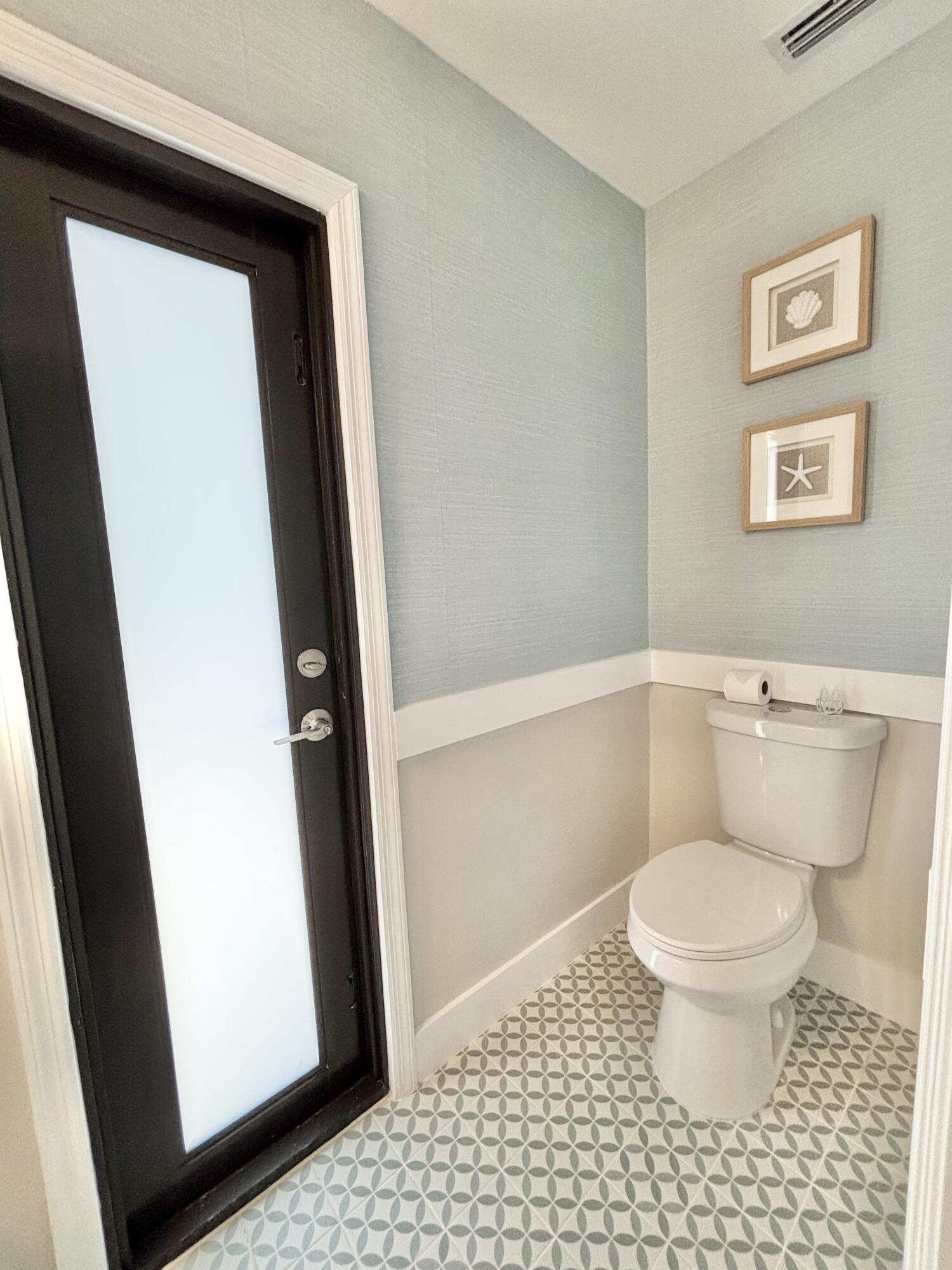 14 Southeast Paddock Circle Jupiter, FL 33469 - Photo 34 of 45 a bathroom with a toilet and a shower