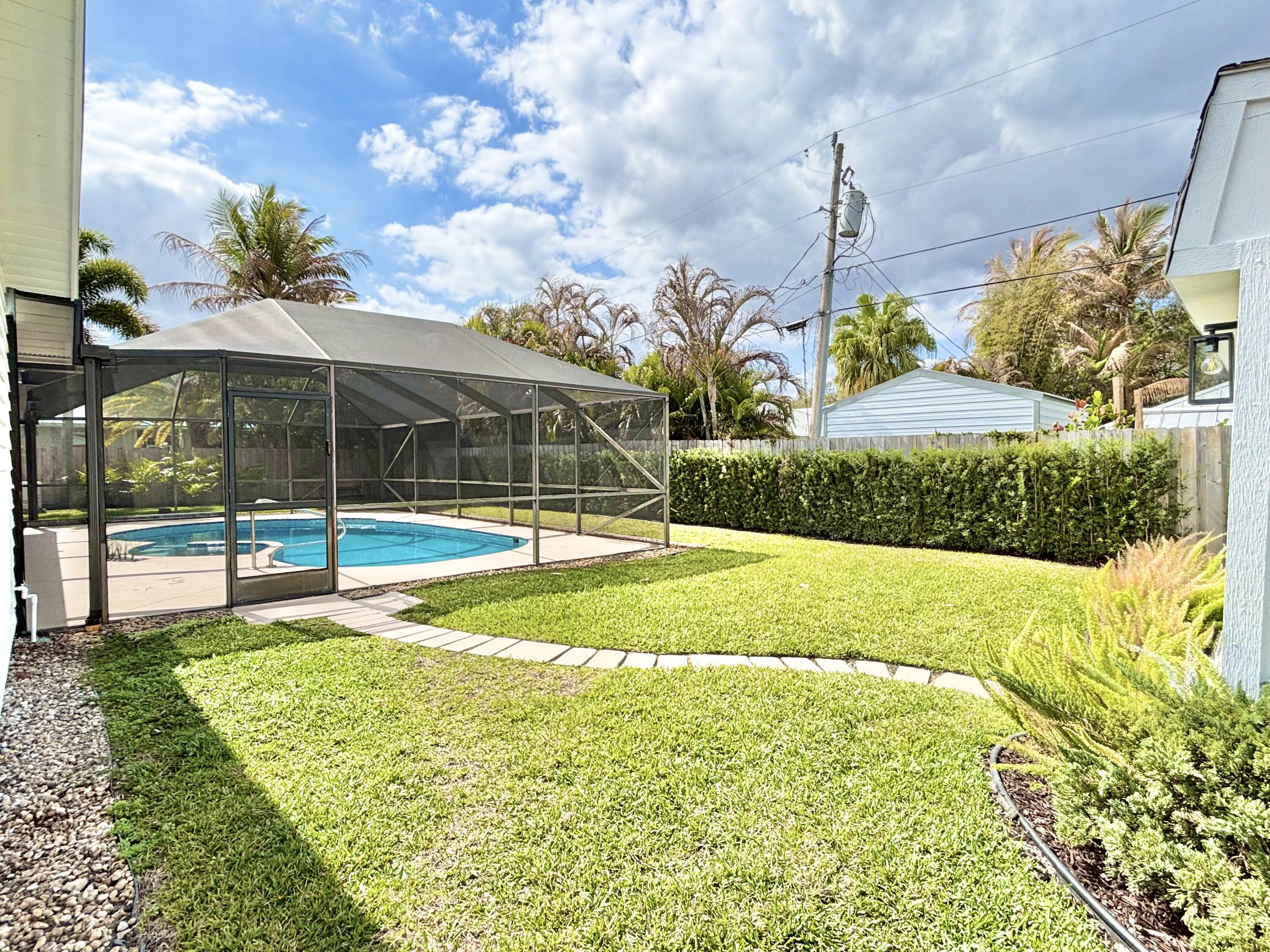 14 Southeast Paddock Circle Jupiter, FL 33469 - Photo 37 of 45 a view of a playground with basketball court