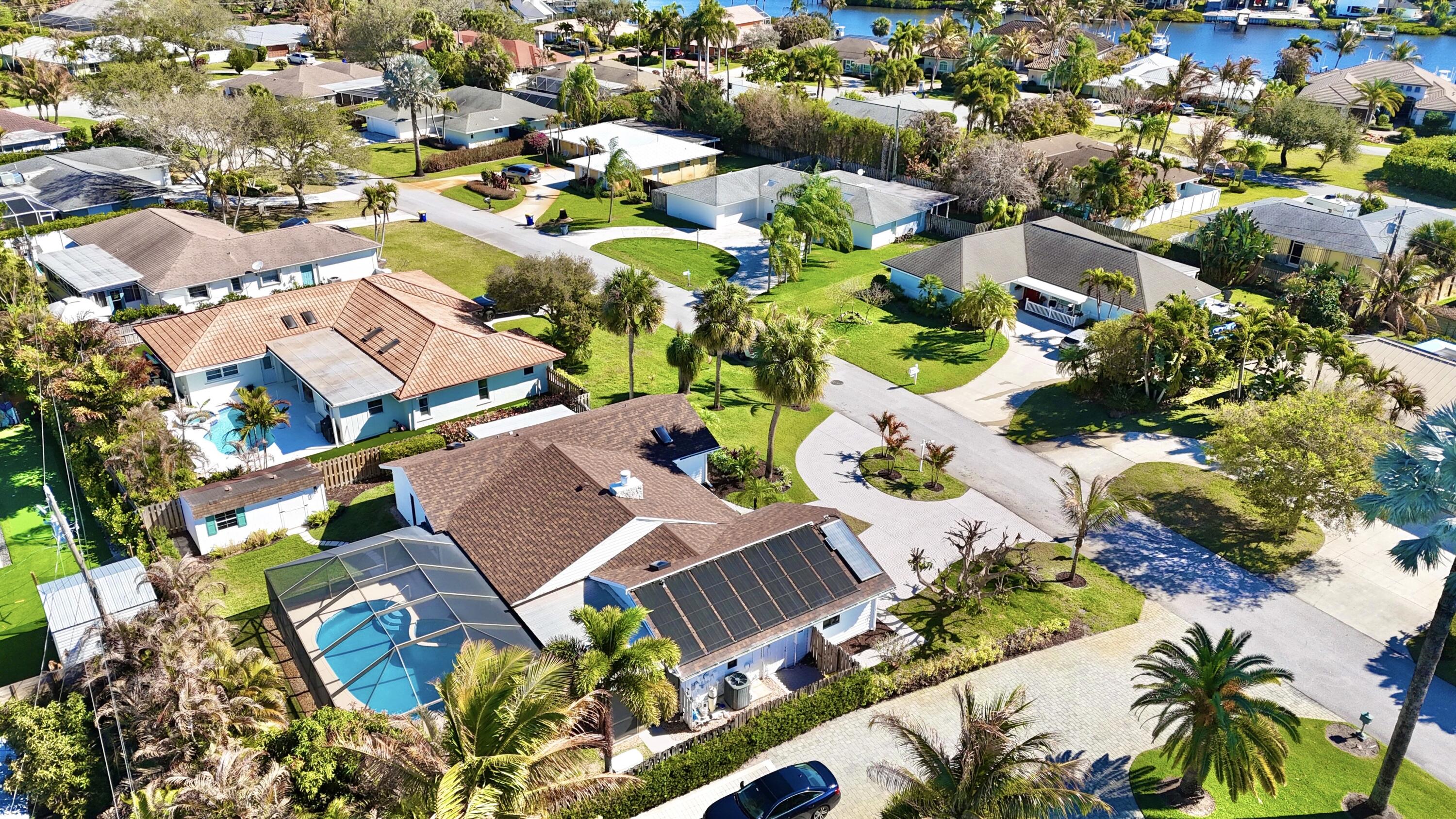 14 Southeast Paddock Circle Jupiter, FL 33469 - Photo 45 of 45 an aerial view of residential houses with outdoor space
