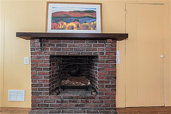 30 Cochituate Road Wayland, MA 01778 - Photo 12 of 30 a fireplace with a painting on the wall