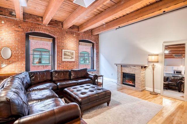 a living room with furniture or couch and a fireplace