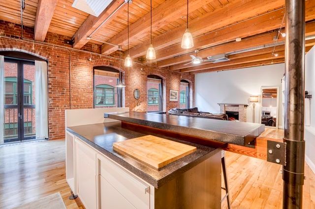 a kitchen with a stove and a refrigerator