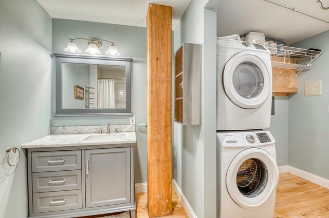 a view of a bedroom with washer and dryer