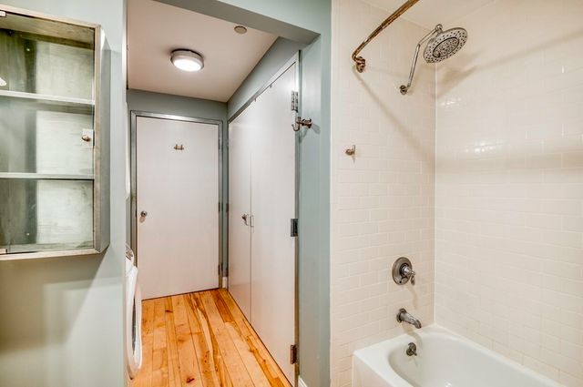 a bathroom with a bathtub and a shower