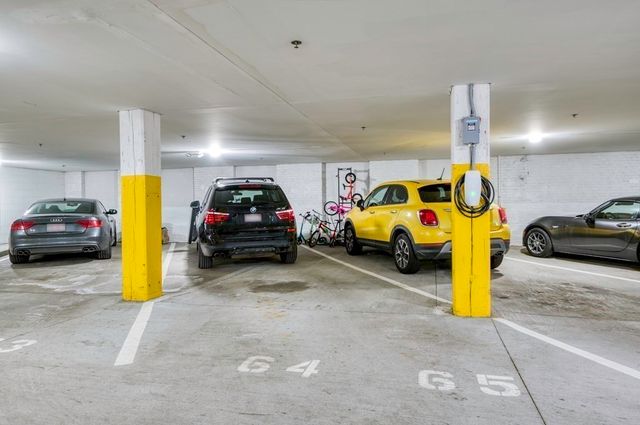 a view of parking with cars parked