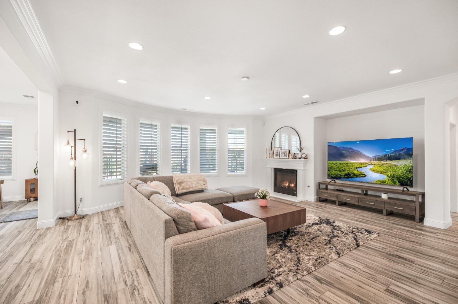 261 North Terry Avenue Clovis, CA 93612 - Photo 11 of 51 a living room with furniture and a flat screen tv