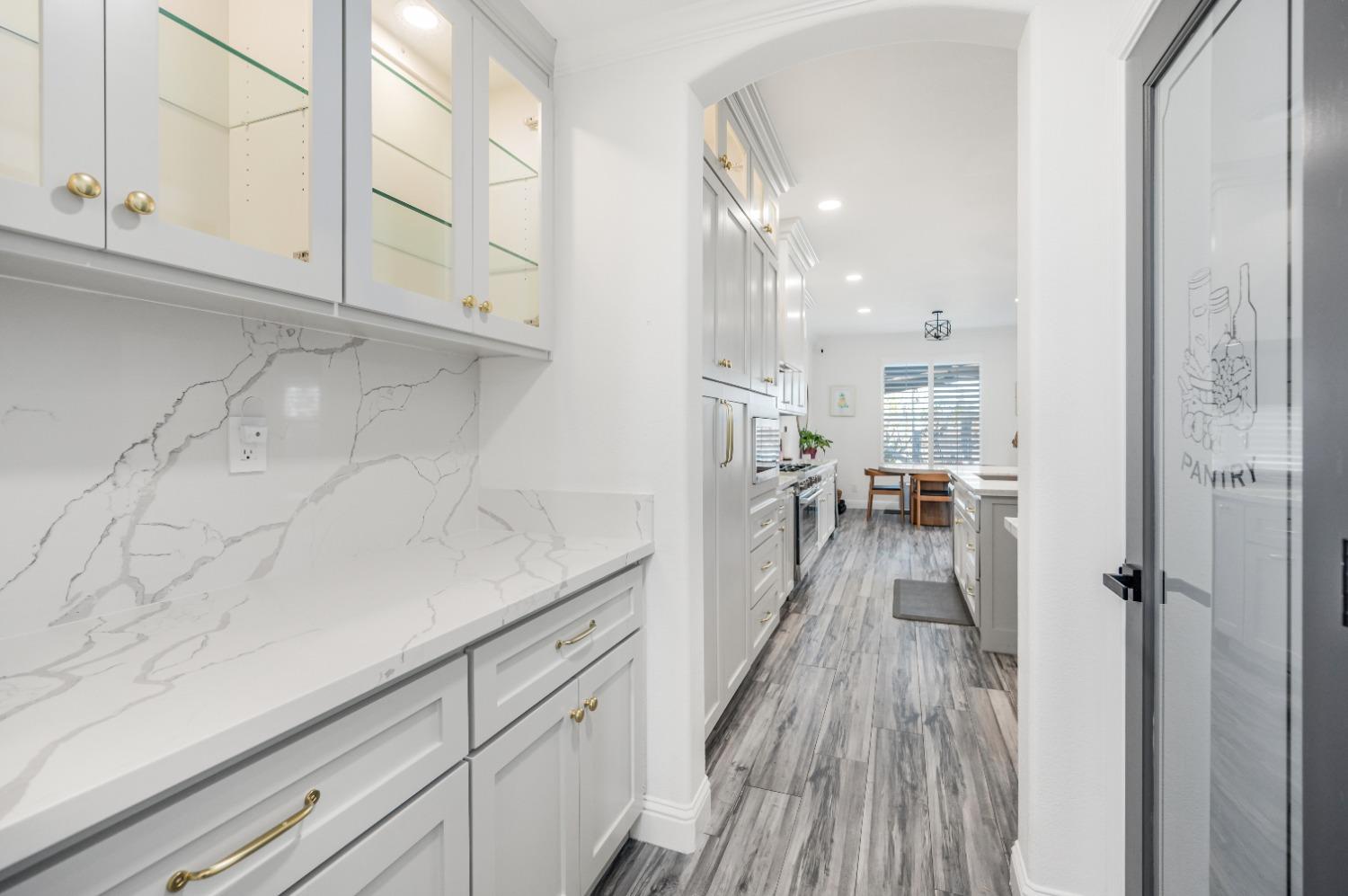 261 North Terry Avenue Clovis, CA 93612 - Photo 21 of 51 a view of a kitchen cabinets and wooden floor