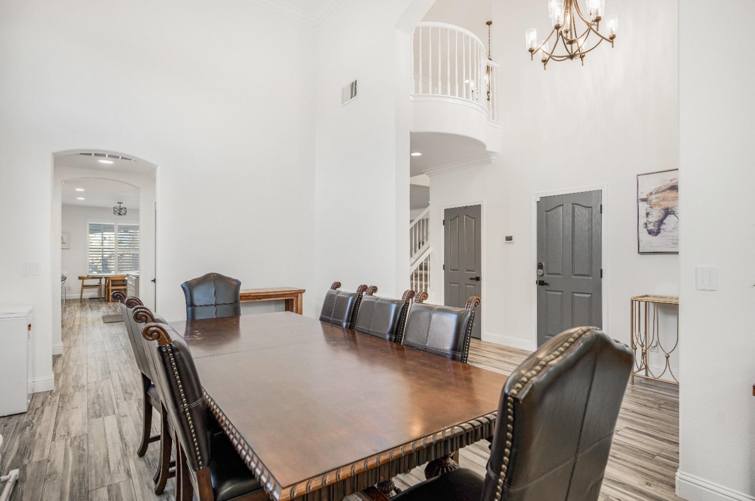 261 North Terry Avenue Clovis, CA 93612 - Photo 9 of 51 a view of a dining room with furniture and wooden floor