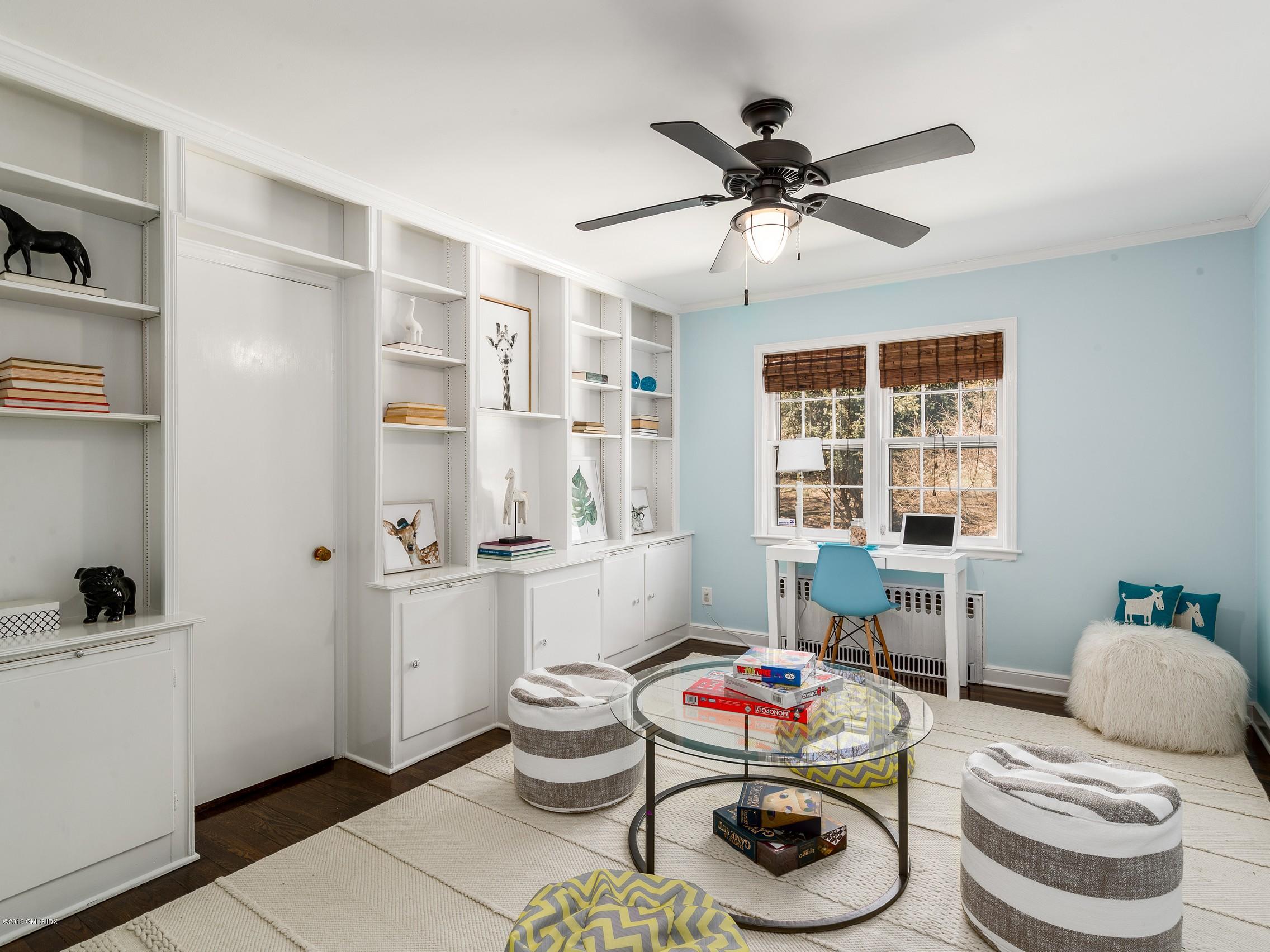 66 Bruce Park Drive Greenwich, CT 06830 - Photo 15 of 27 a living room with furniture and a window