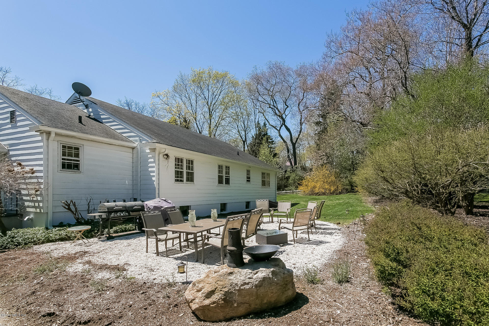 66 Bruce Park Drive Greenwich, CT 06830 - Photo 16 of 27 a view of a backyard with furniture