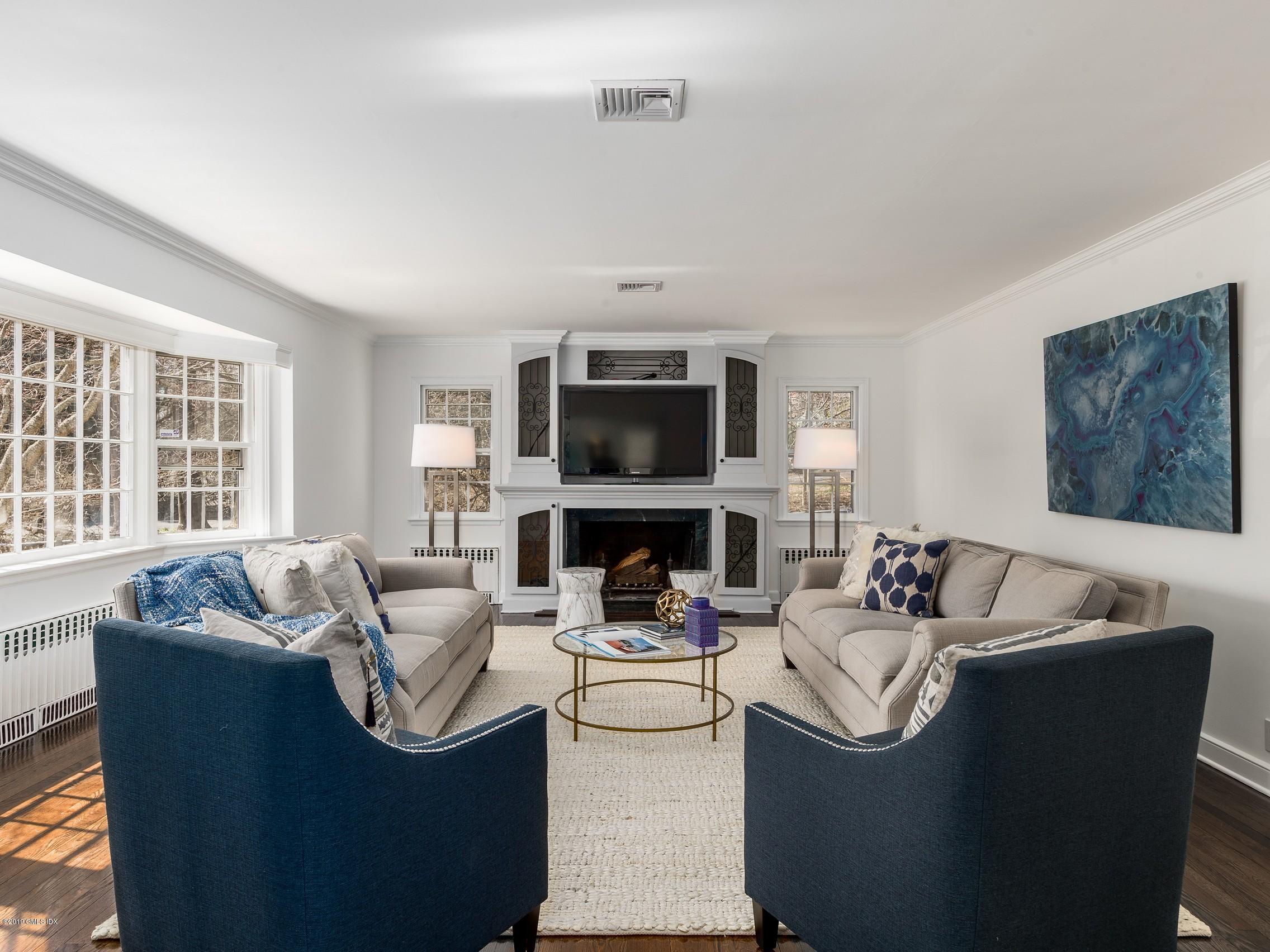 66 Bruce Park Drive Greenwich, CT 06830 - Photo 4 of 27 a living room with furniture and a flat screen tv
