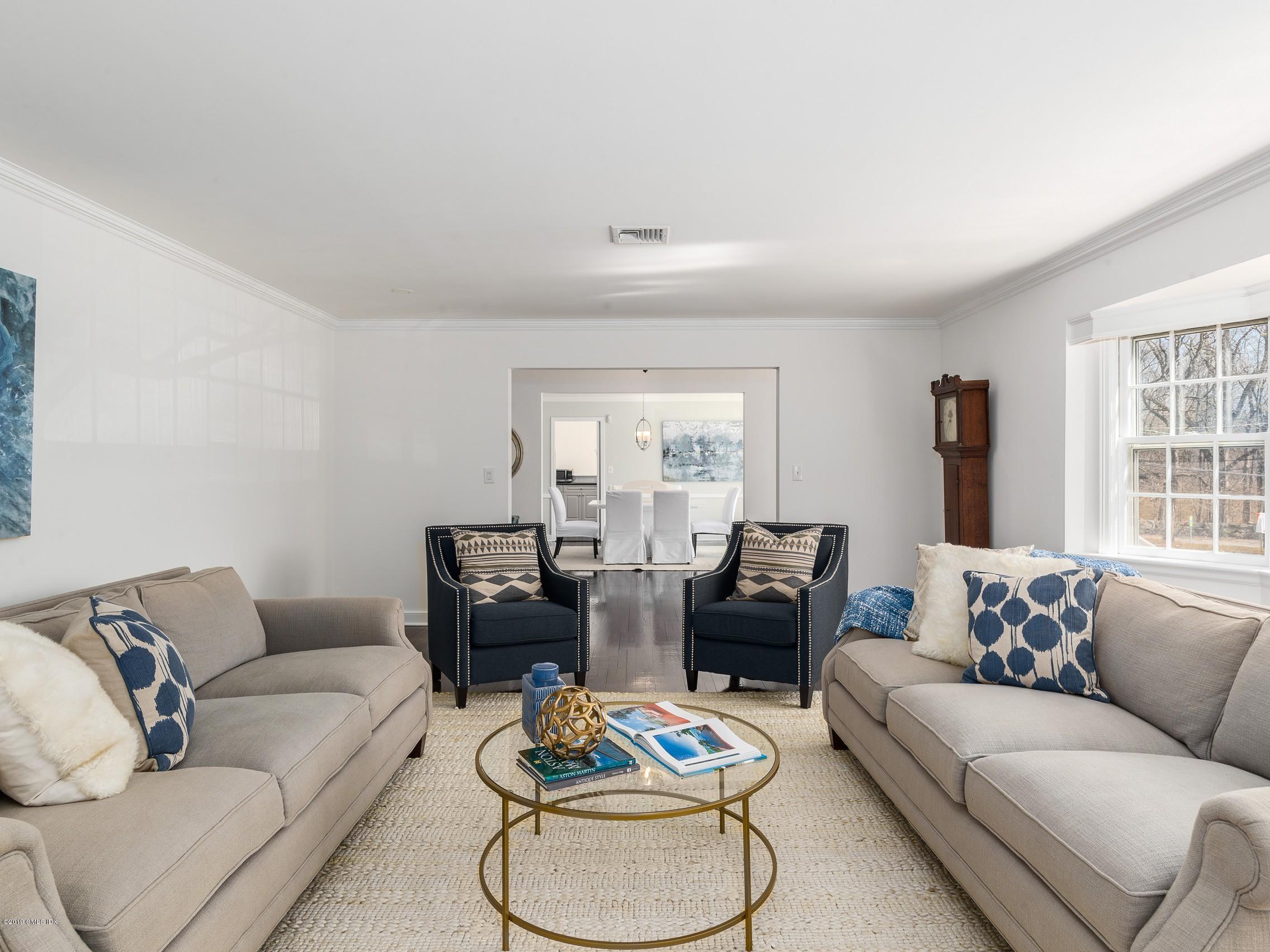 66 Bruce Park Drive Greenwich, CT 06830 - Photo 5 of 27 a living room with furniture and a large window