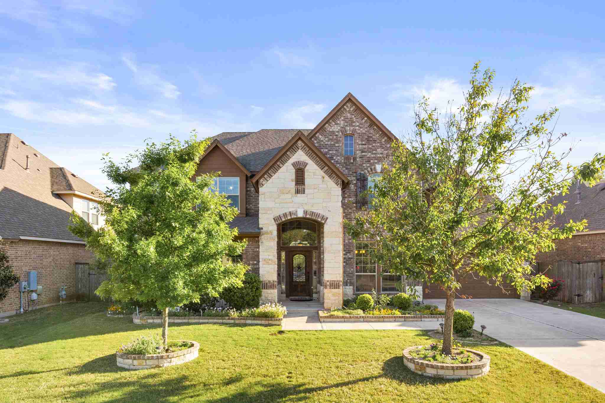 2525 Quick Fort Drive Leander, TX 78641 - Photo 1 of 39 a front view of a house with garden