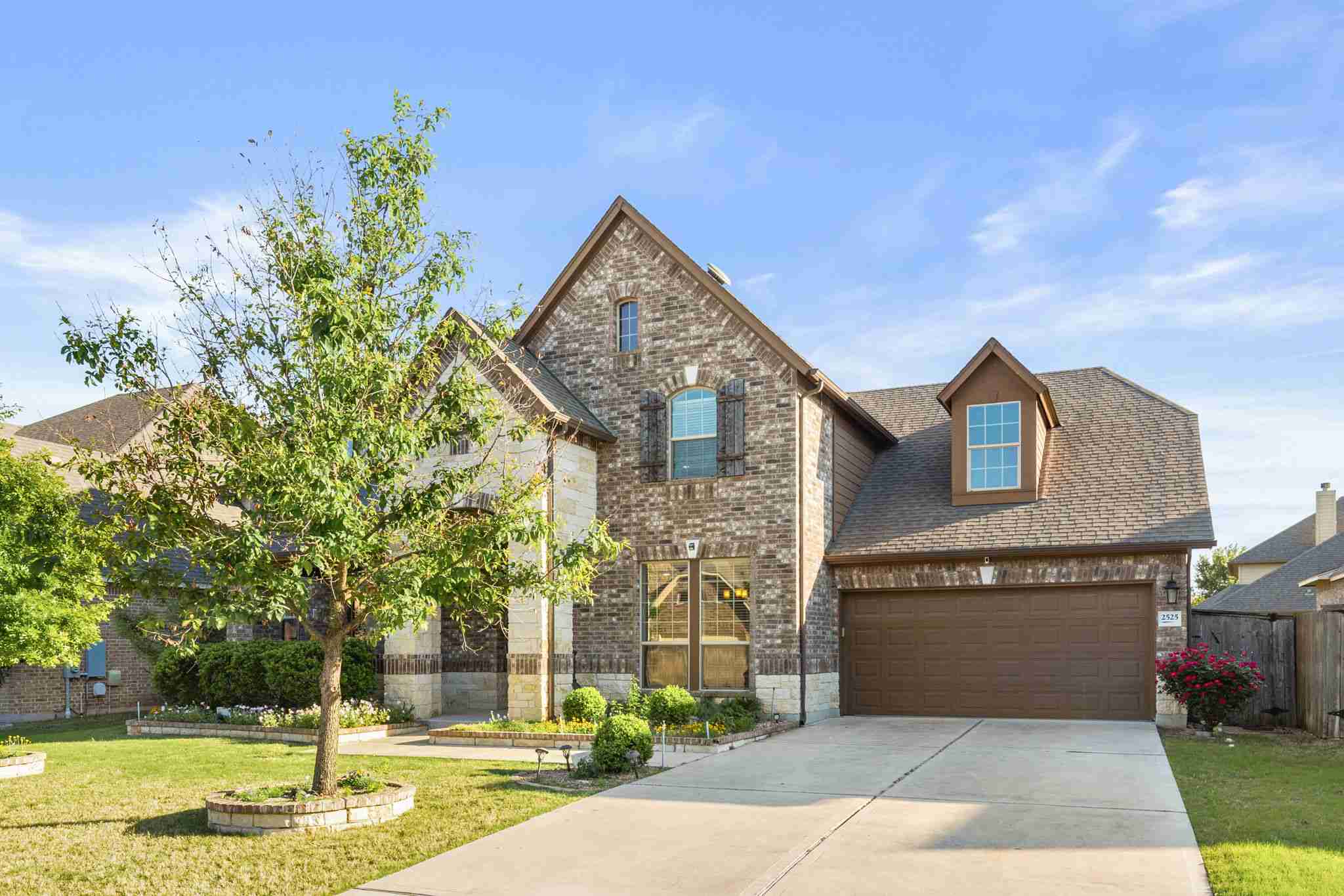 2525 Quick Fort Drive Leander, TX 78641 - Photo 2 of 39 a front view of a house with a yard