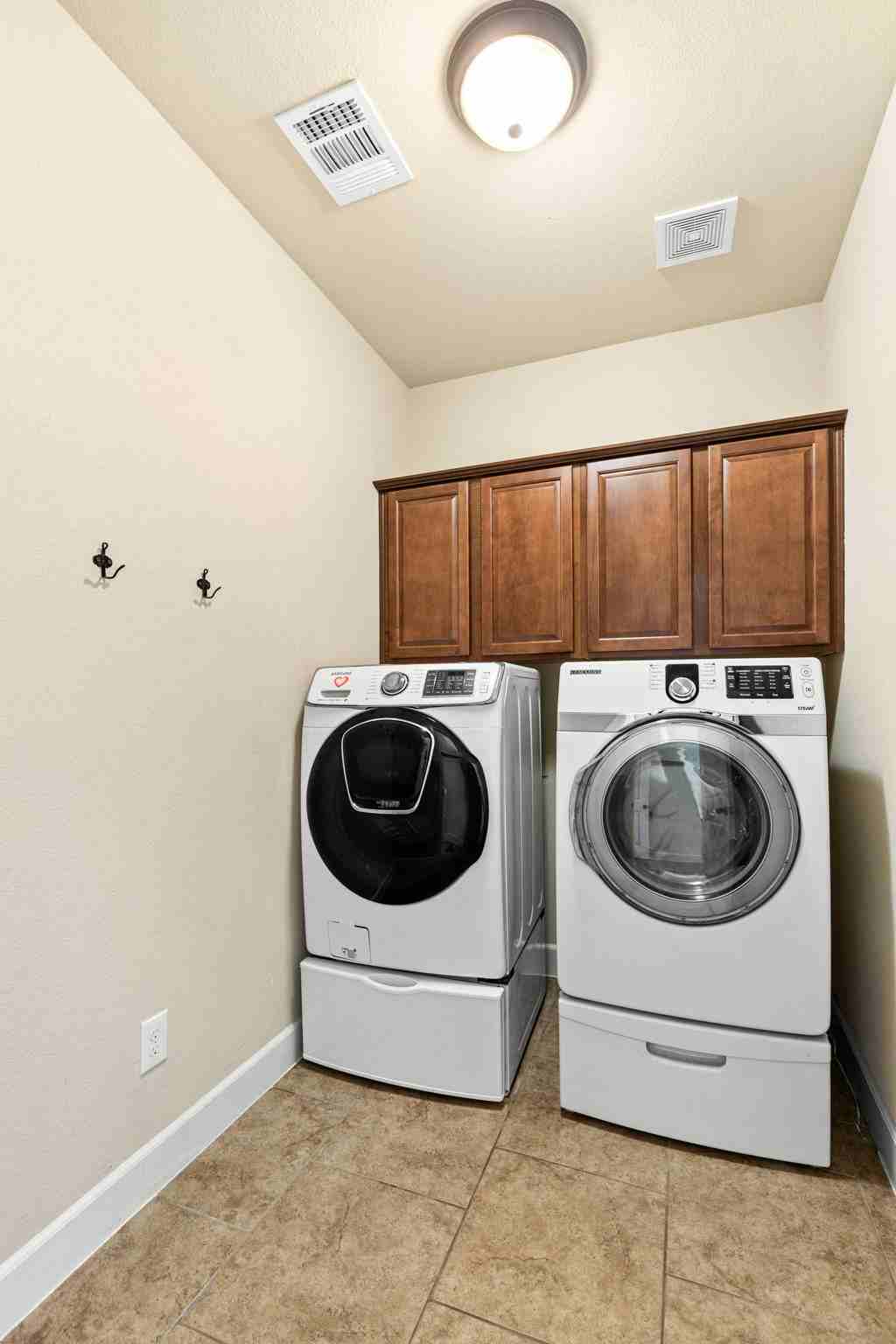 2525 Quick Fort Drive Leander, TX 78641 - Photo 22 of 39 a utility room with dryer and washer