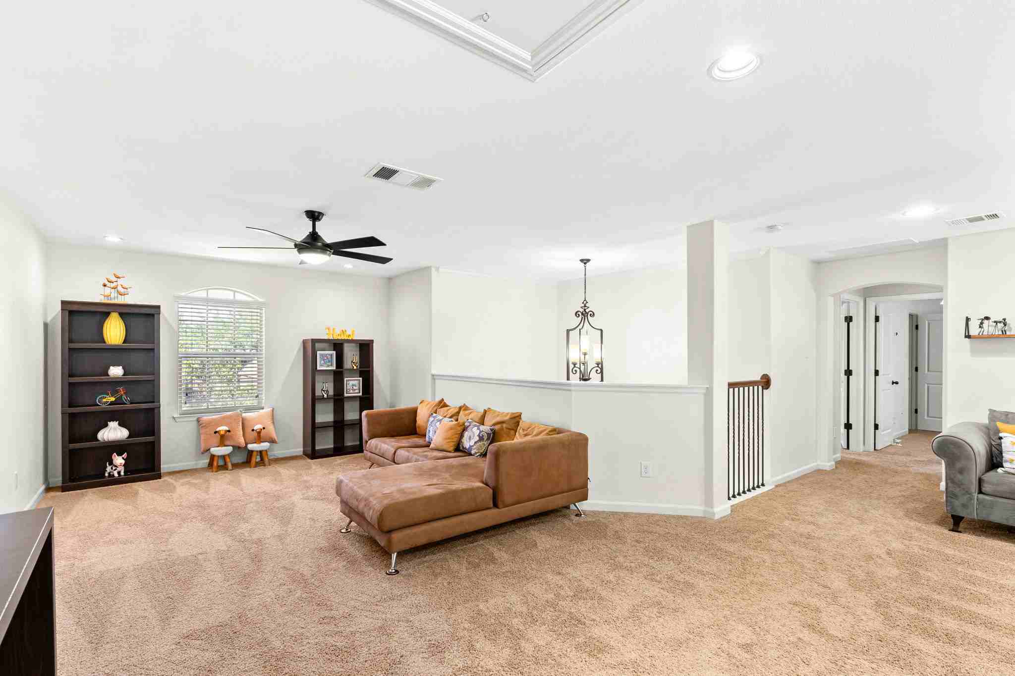 2525 Quick Fort Drive Leander, TX 78641 - Photo 23 of 39 a bedroom with furniture and a flat screen tv