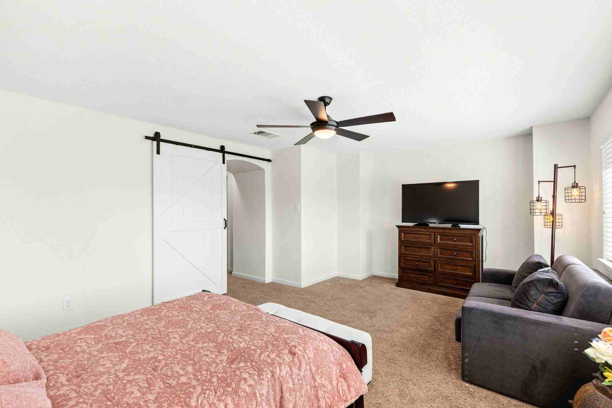 2525 Quick Fort Drive Leander, TX 78641 - Photo 25 of 39 a bedroom with a bed and a flat screen tv