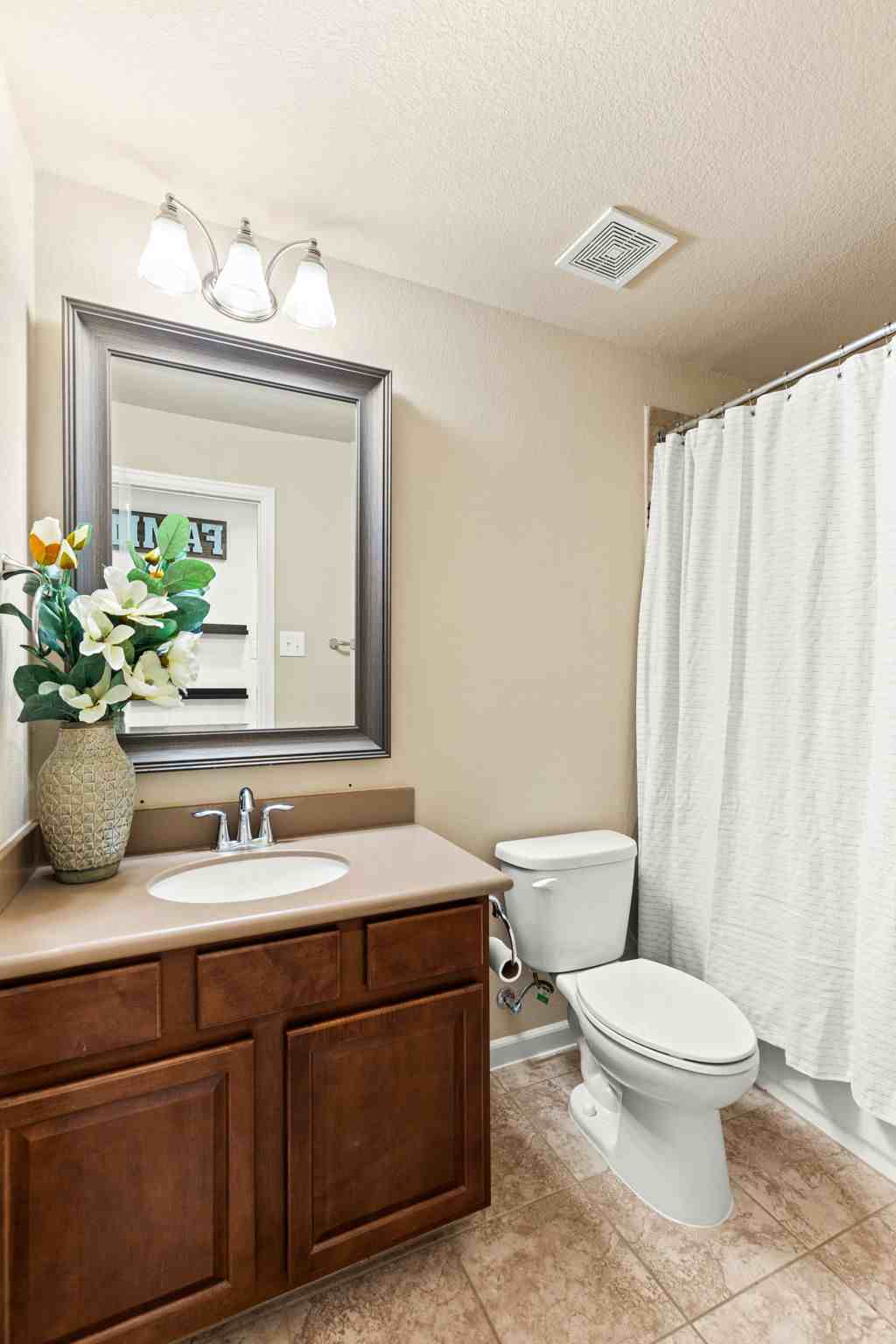 2525 Quick Fort Drive Leander, TX 78641 - Photo 26 of 39 a bathroom with a toilet a sink and a mirror