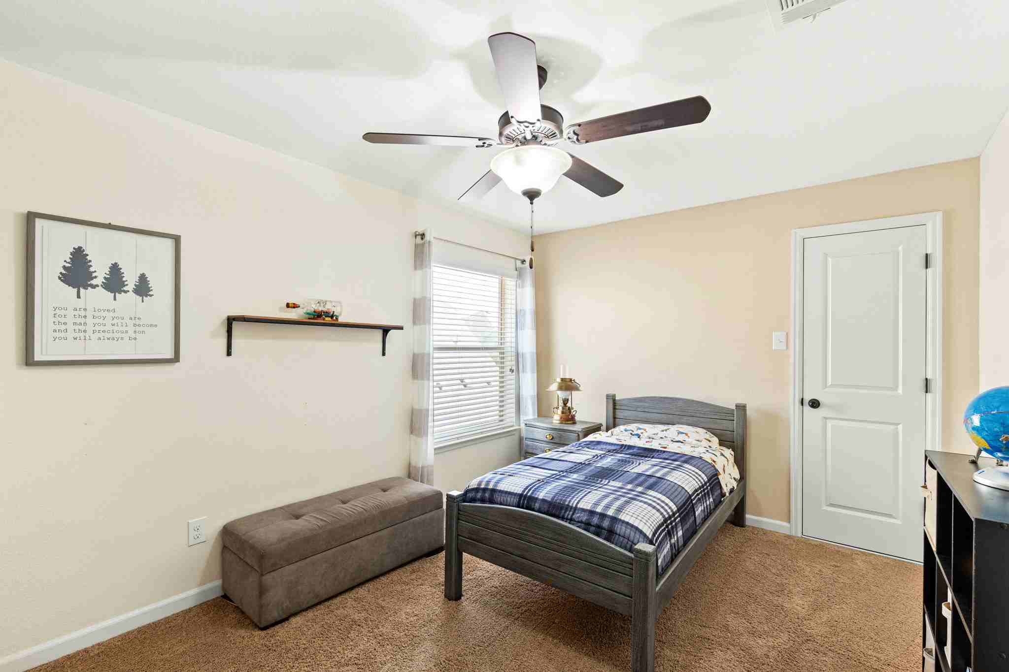 2525 Quick Fort Drive Leander, TX 78641 - Photo 29 of 39 a bedroom with a bed couch and window