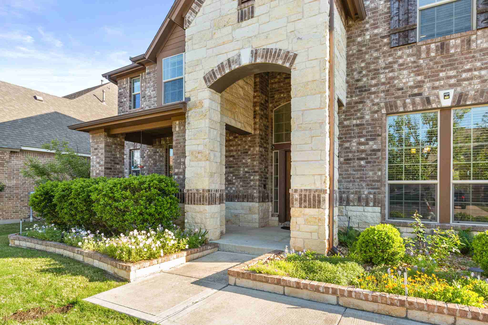 2525 Quick Fort Drive Leander, TX 78641 - Photo 3 of 39 a front view of a house with garden