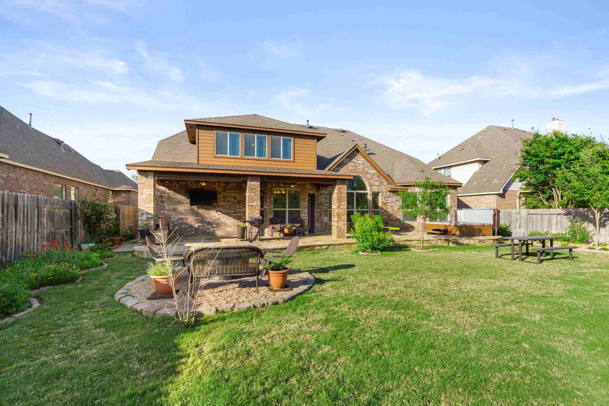 2525 Quick Fort Drive Leander, TX 78641 - Photo 32 of 39 a view of a house with backyard sitting area and garden
