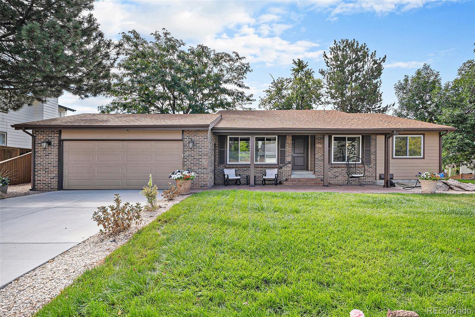 904 Fieldstone Place Highlands Ranch, CO 80126 - Photo 1 of 28 a front view of a house with yard patio and green space