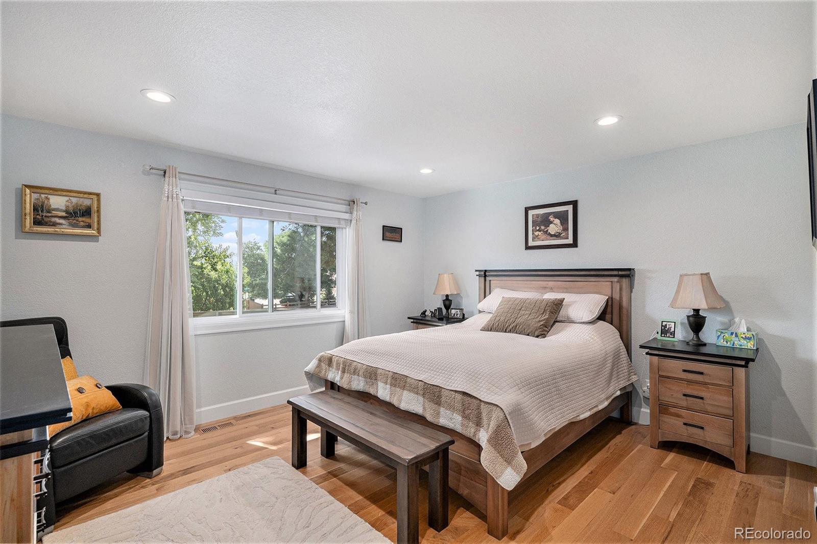 904 Fieldstone Place Highlands Ranch, CO 80126 - Photo 11 of 28 a bedroom with a bed and a window
