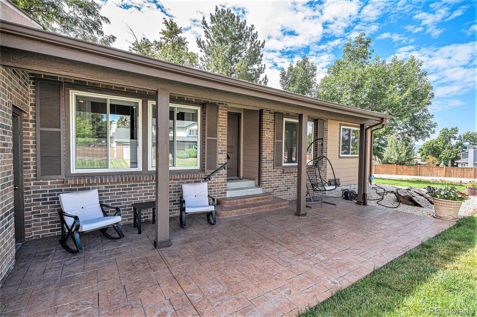 904 Fieldstone Place Highlands Ranch, CO 80126 - Photo 2 of 28 a view of a house with backyard sitting area and garden