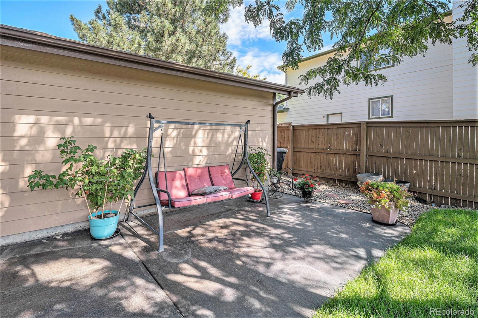 904 Fieldstone Place Highlands Ranch, CO 80126 - Photo 21 of 28 a view of a two chairs in the back yard of the house