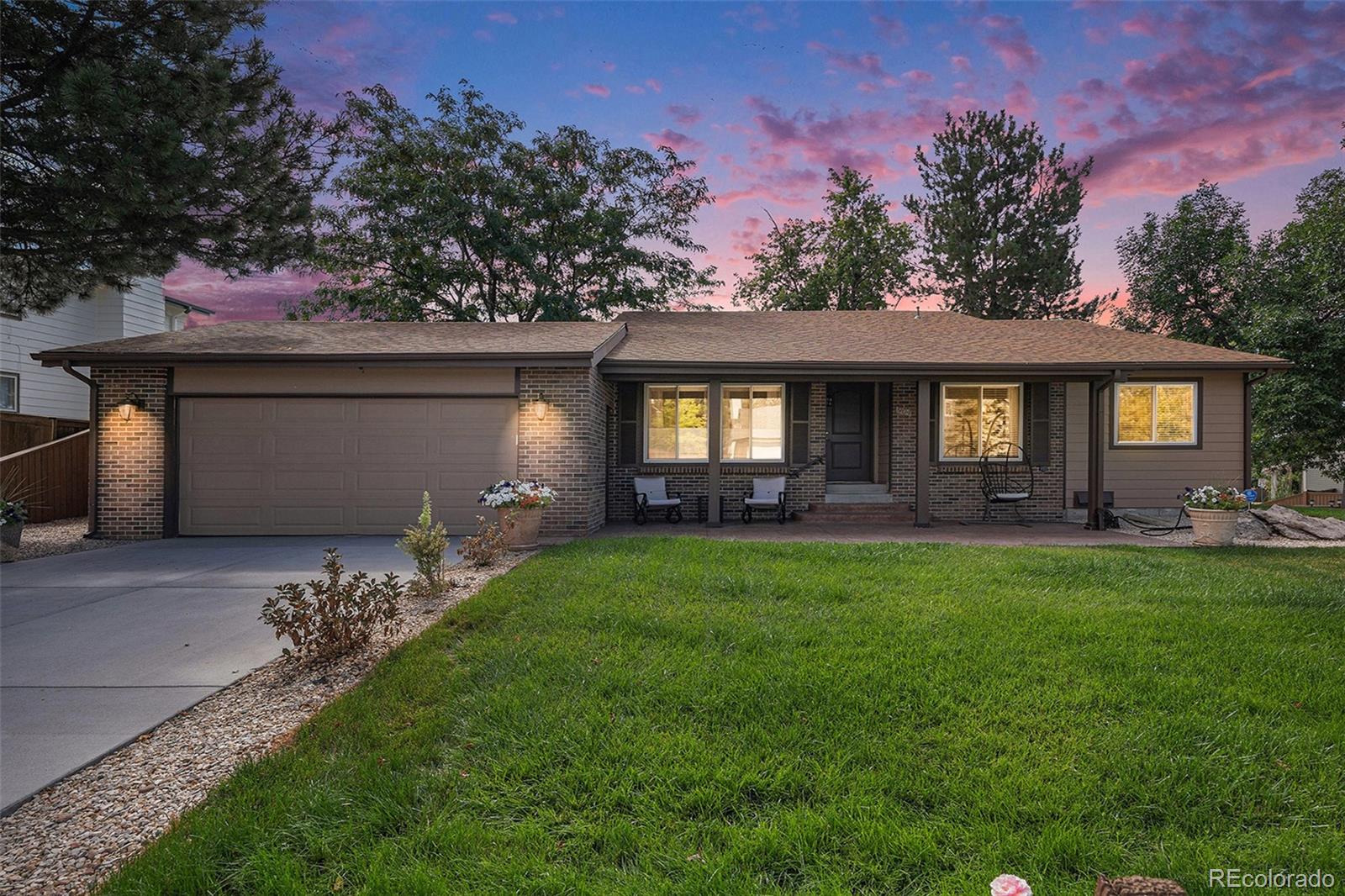 904 Fieldstone Place Highlands Ranch, CO 80126 - Photo 23 of 28 a front view of a house with a garden