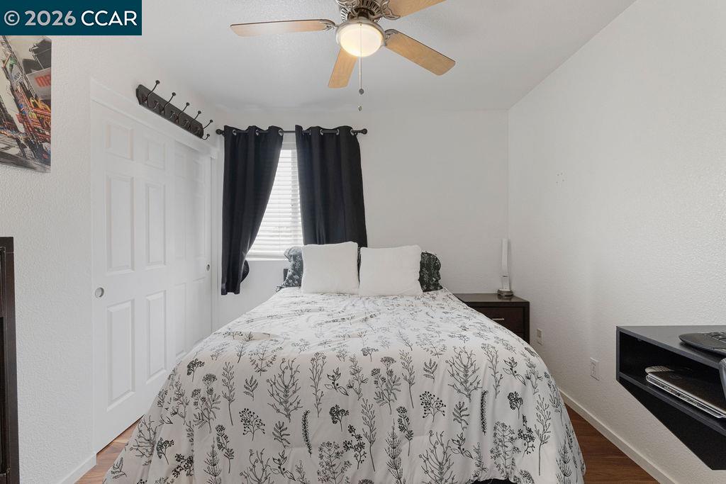 645 Anderson Way Rio Vista, CA 94571 - Photo 20 of 47 a bedroom with a bed and a chandelier