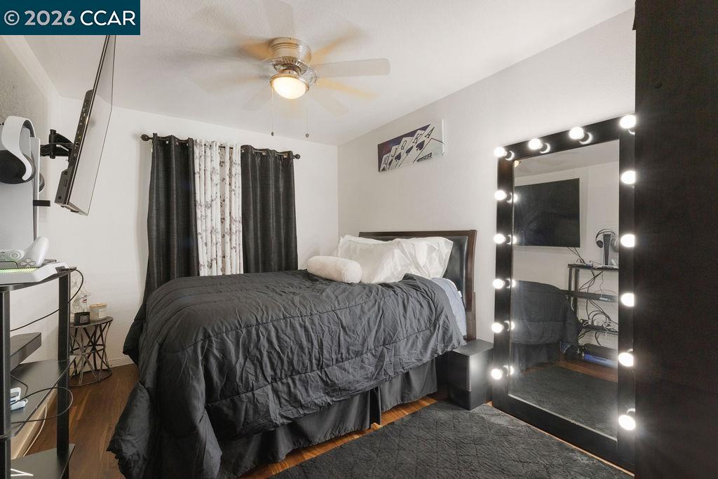 645 Anderson Way Rio Vista, CA 94571 - Photo 24 of 47 a bedroom with a bed and a chandelier