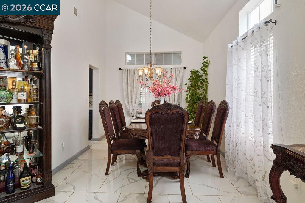 645 Anderson Way Rio Vista, CA 94571 - Photo 30 of 47 a view of a dining room with furniture and chandelier