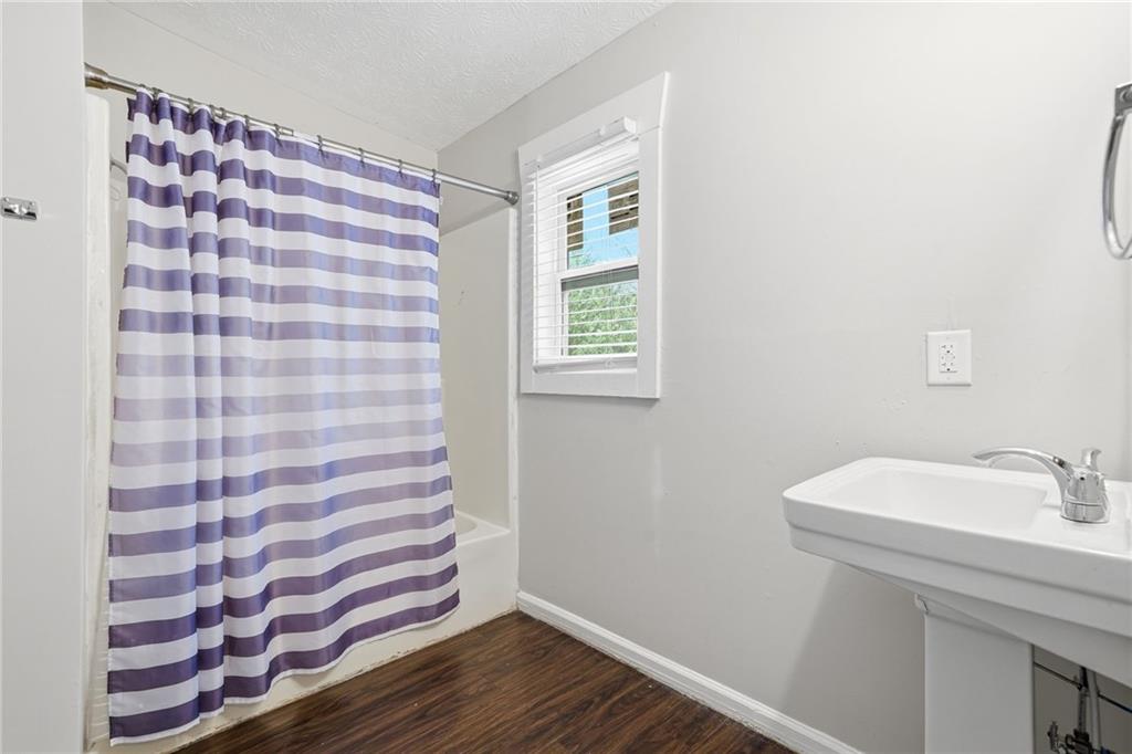 212 Chandler Street, Unit 4 Calhoun, GA 30701 - Photo 11 of 17 a bathroom with a sink and a mirror