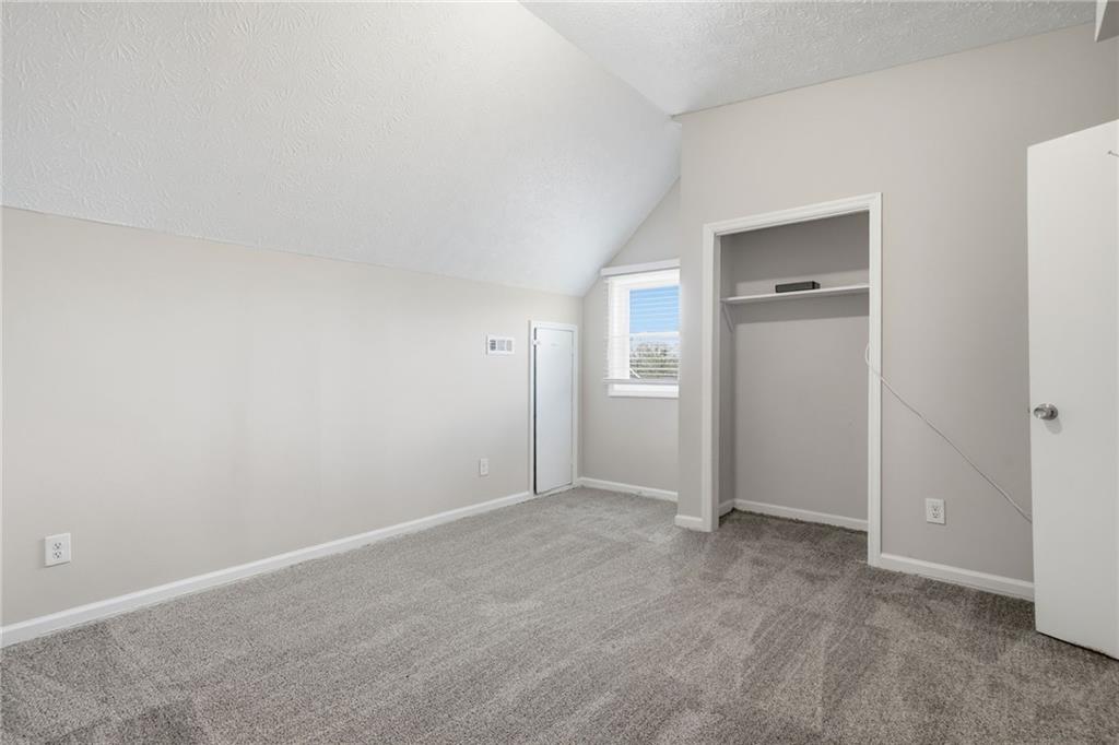 212 Chandler Street, Unit 4 Calhoun, GA 30701 - Photo 12 of 17 an empty room with closet and a bathroom