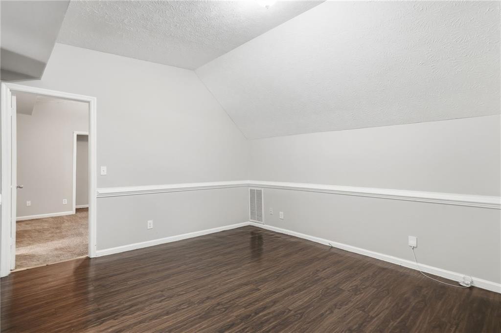 212 Chandler Street, Unit 4 Calhoun, GA 30701 - Photo 4 of 17 a view of a room with wooden floor