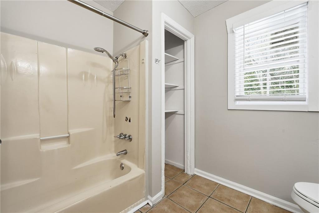 212 Chandler Street, Unit 4 Calhoun, GA 30701 - Photo 9 of 17 a bathroom with a bathtub and a shower