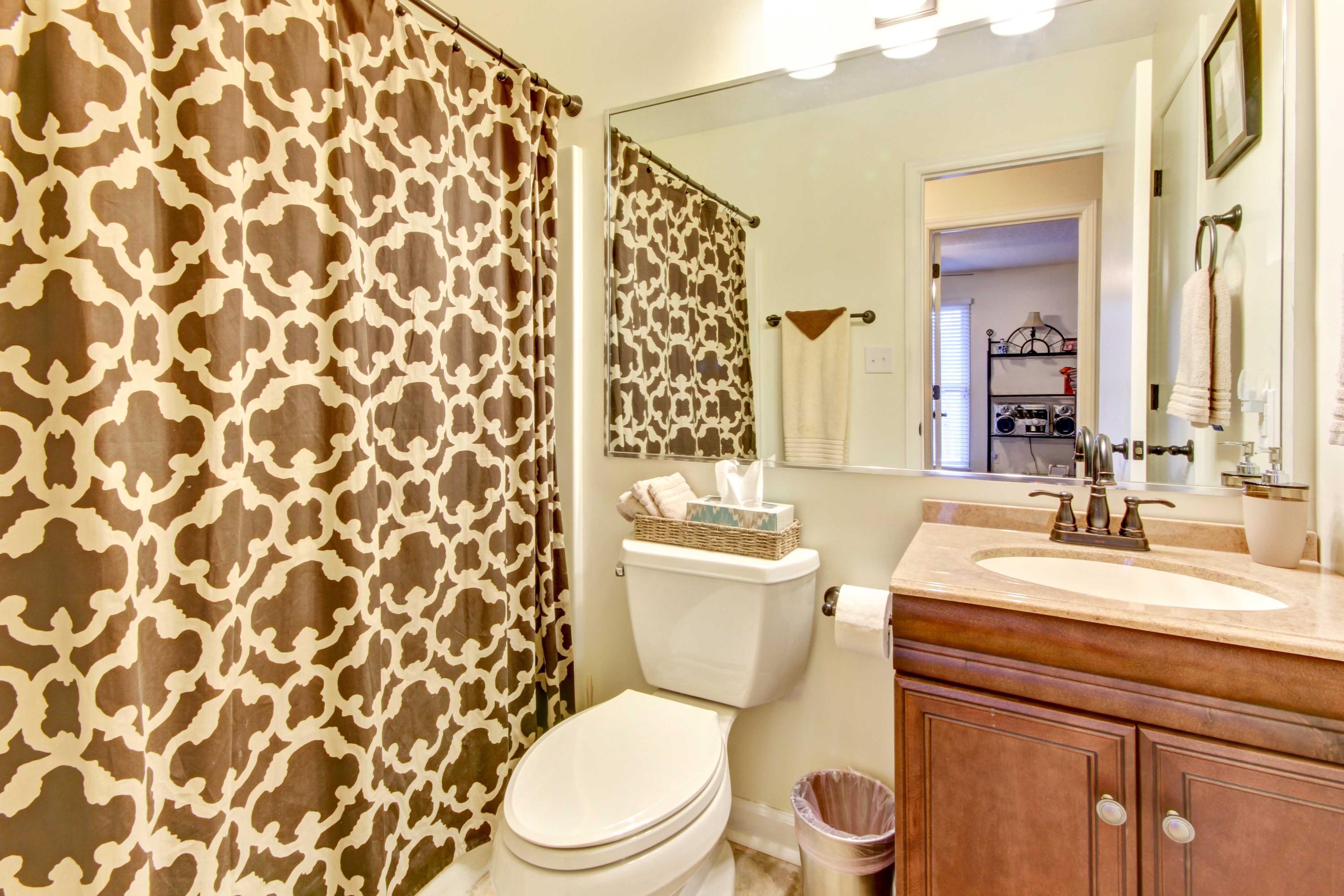 3355 Turner Branch Road Vinton, VA 24179 - Photo 12 of 58 a white toilet sitting next to a bathroom sink