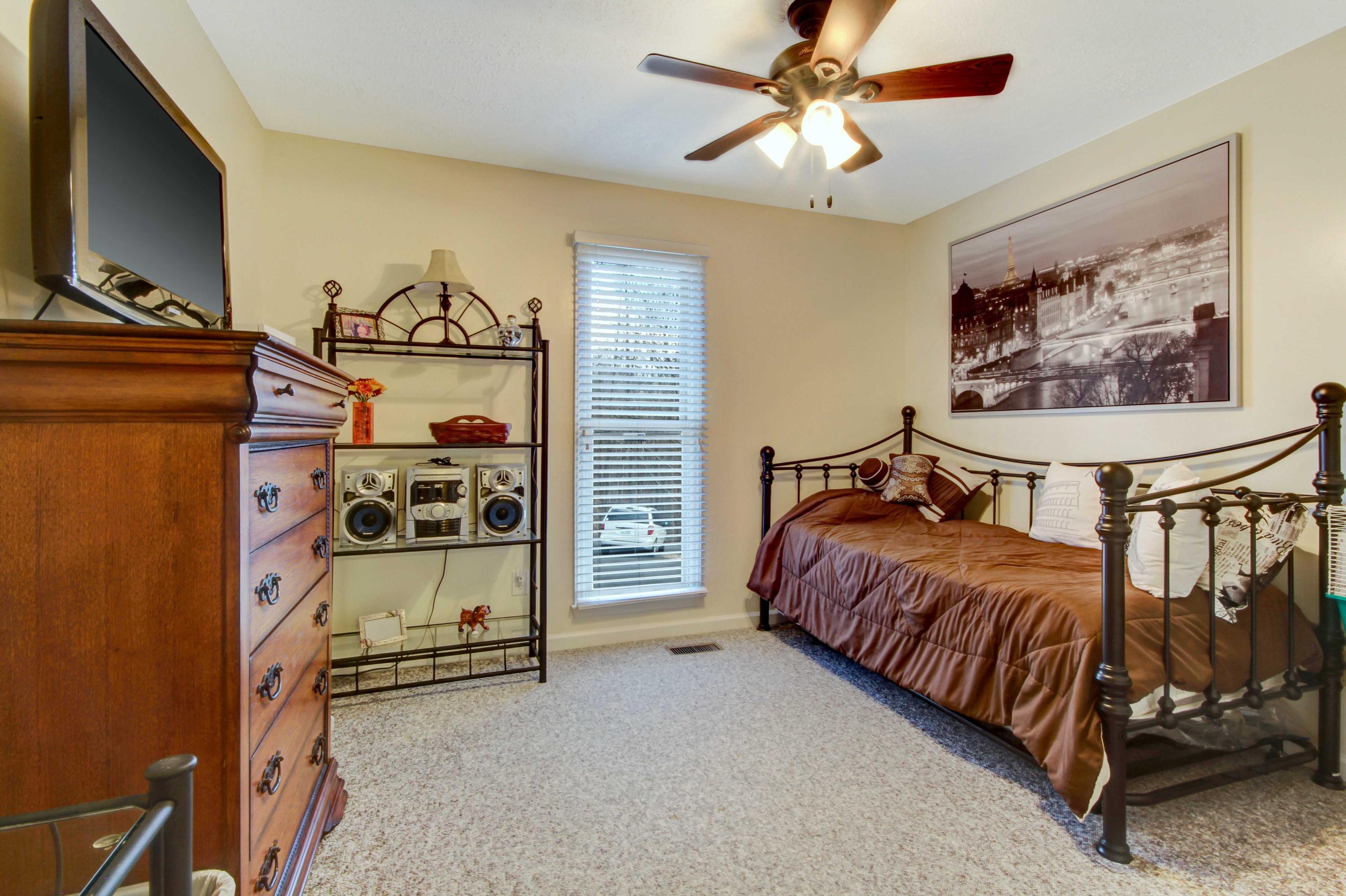 3355 Turner Branch Road Vinton, VA 24179 - Photo 18 of 58 a bedroom with a bed and a flat tv screen on the dresser