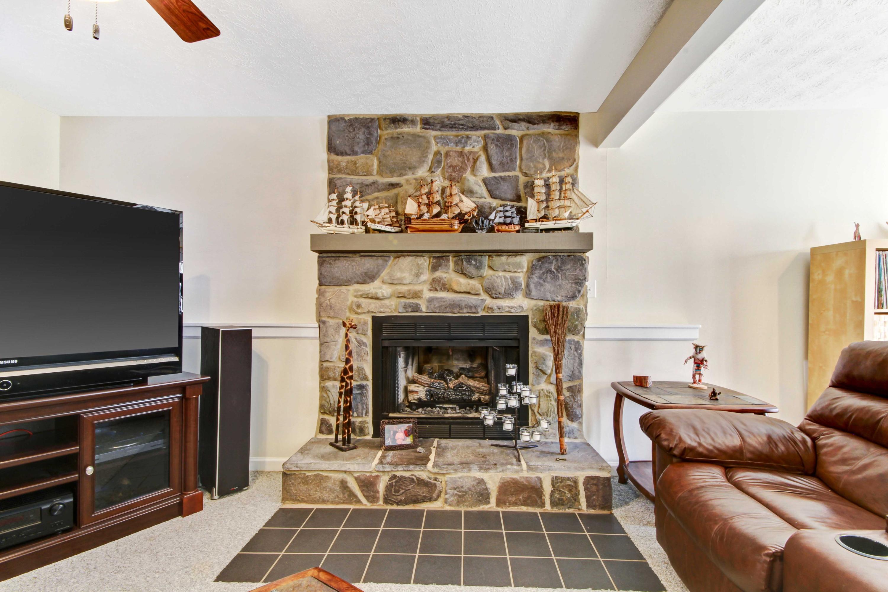 3355 Turner Branch Road Vinton, VA 24179 - Photo 22 of 58 a living room with furniture a flat screen tv and a fireplace