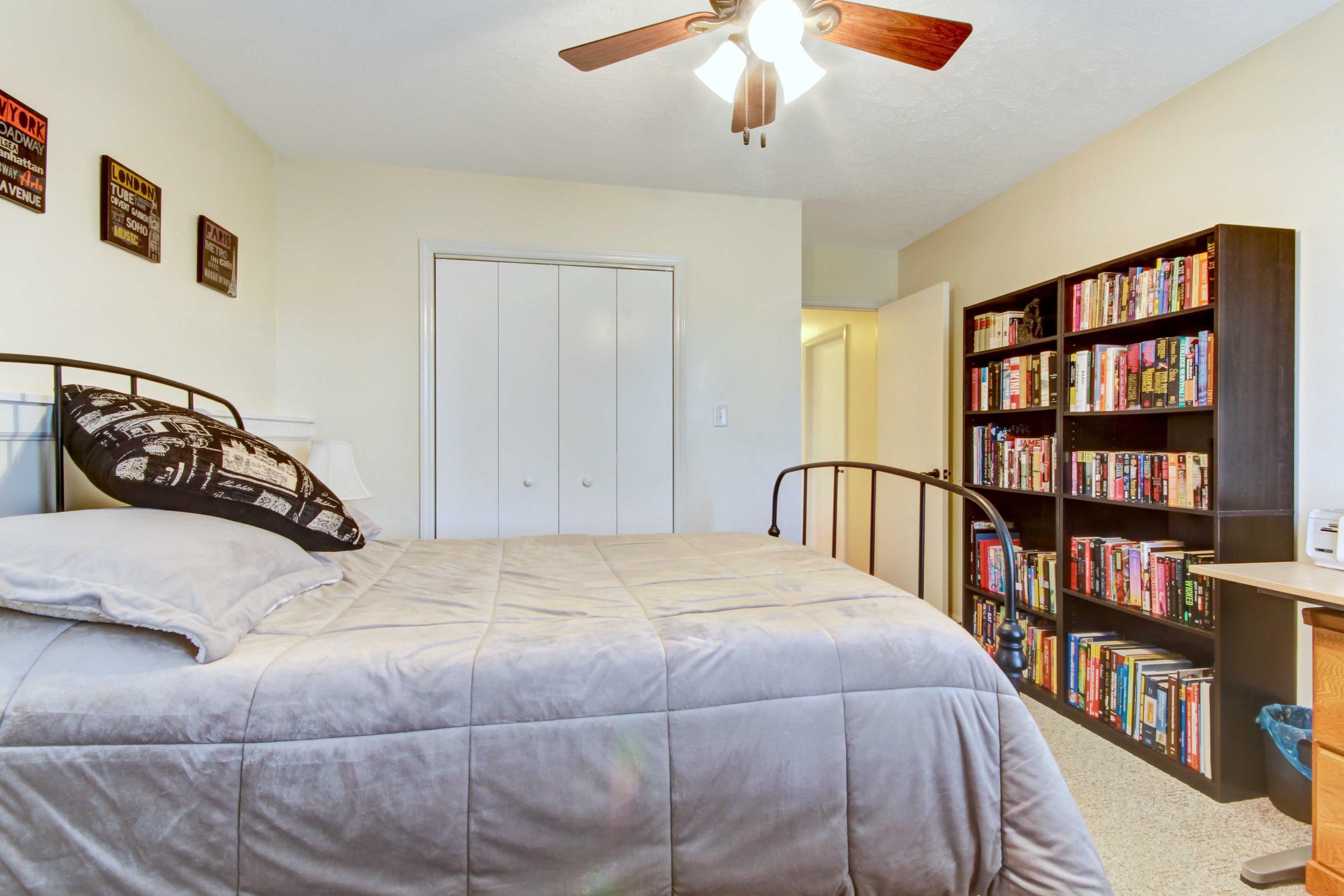 3355 Turner Branch Road Vinton, VA 24179 - Photo 26 of 58 a bedroom with a bed a book shelf and a book shelf