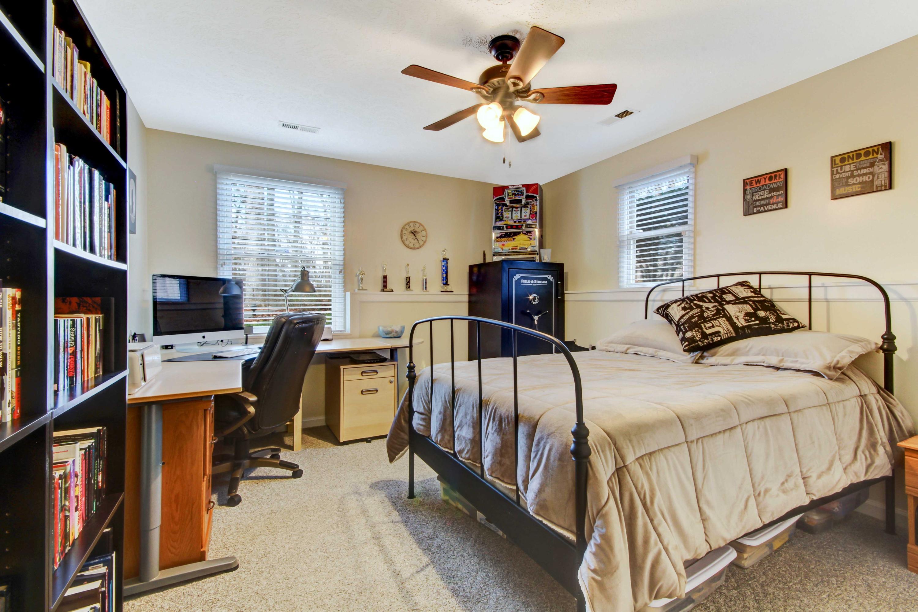 3355 Turner Branch Road Vinton, VA 24179 - Photo 27 of 58 a bedroom with a bed a computer on the desk and a book shelf