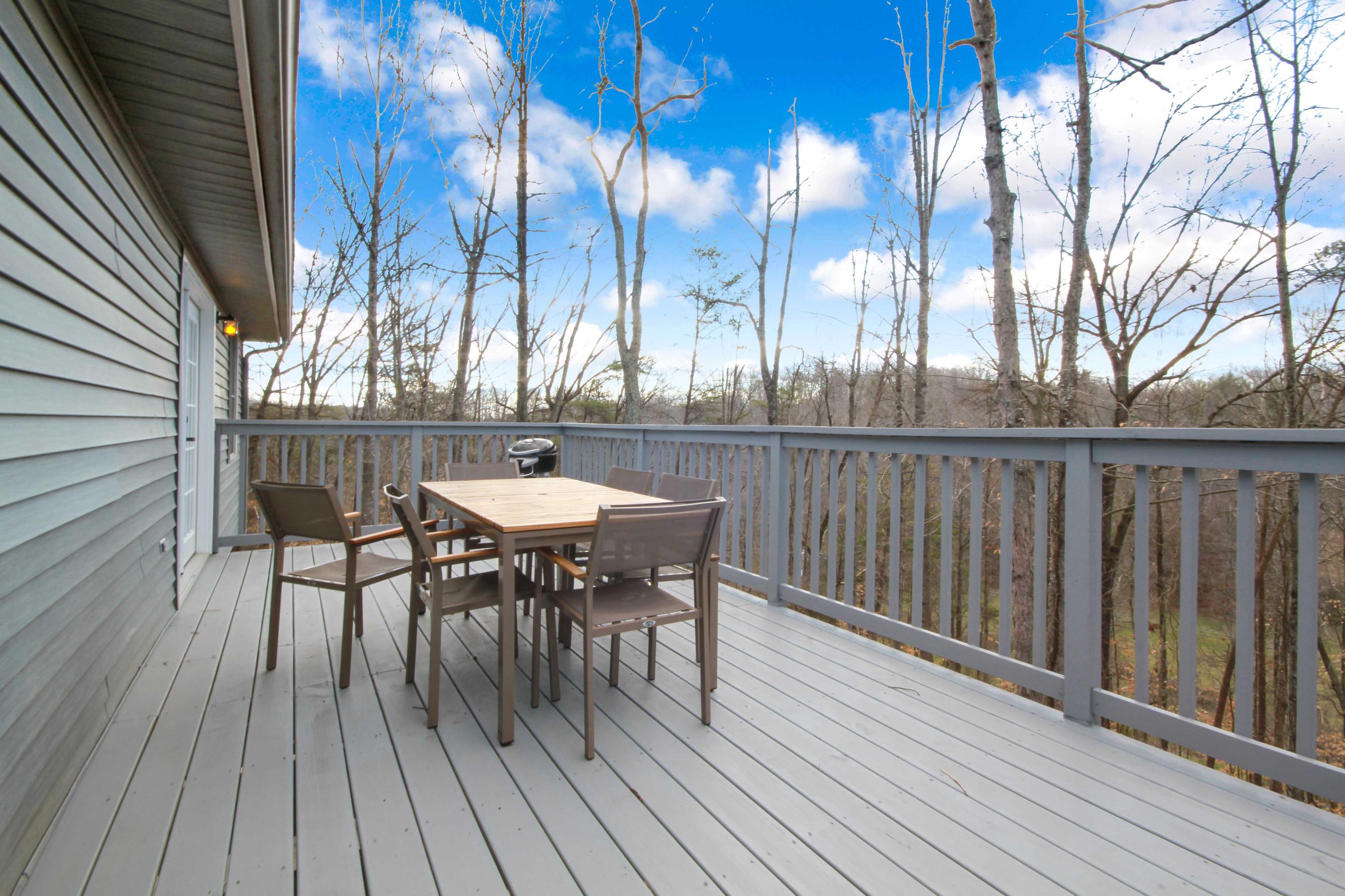 3355 Turner Branch Road Vinton, VA 24179 - Photo 36 of 58 a view of a roof deck with table and chairs and wooden floor