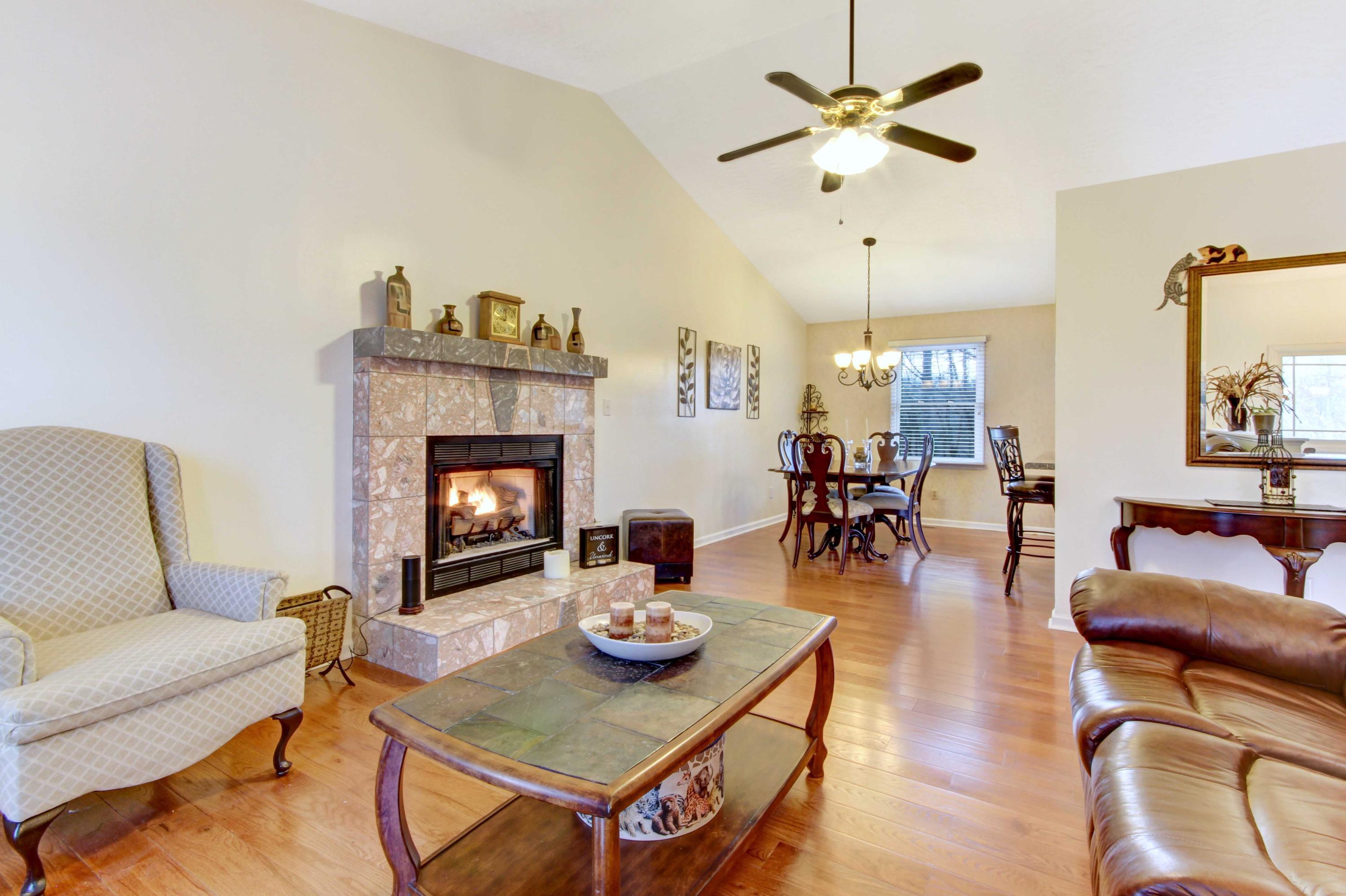 3355 Turner Branch Road Vinton, VA 24179 - Photo 5 of 58 a living room with furniture a fireplace and a chandelier